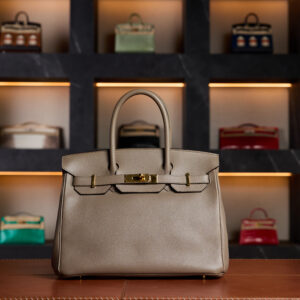 Hermès Birkin 30 in Gris Epsom leather from 2017, featuring elegant Gold Hardware. A structured and durable design showcasing Hermès’ craftsmanship, this pre-loved piece embodies timeless sophistication and refined luxury.